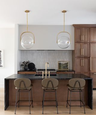 Organic modern kitchen with an island and statement pendant lights