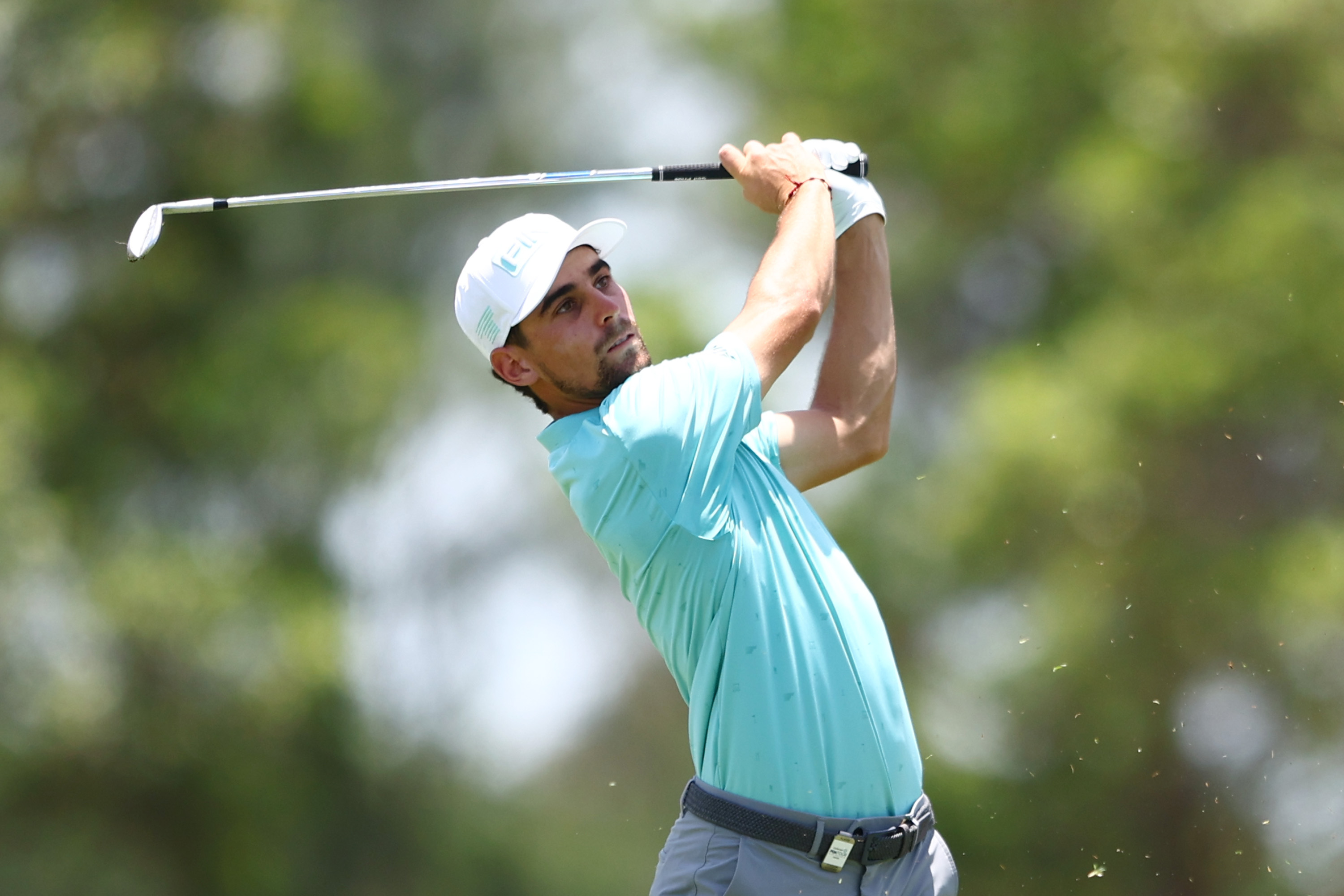 Joaquin Niemann holds his finish on an iron shot