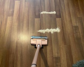 Shark Wandvac on hard floor with porridge oats for testing