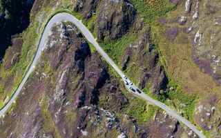 Cars pass each other on a single-track road on the North Coast 500