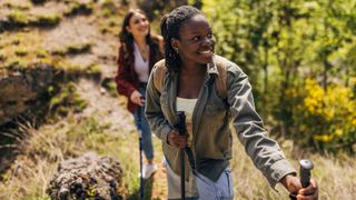 Two women hiking together relaxed