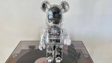 The BE@RBRICK Audio stood on top of a vinyl player