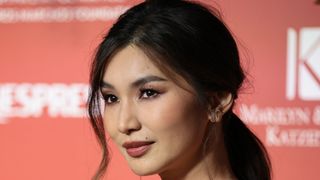gemma chan wearing a low ponytail hairstyle