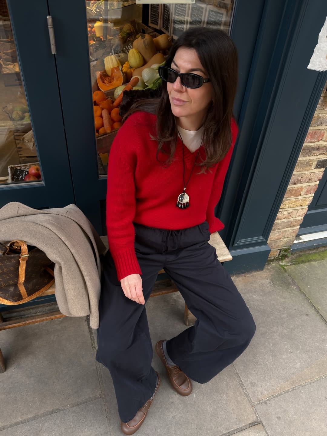 Influencer Francesca Saffari wearing a cord pendant necklace.