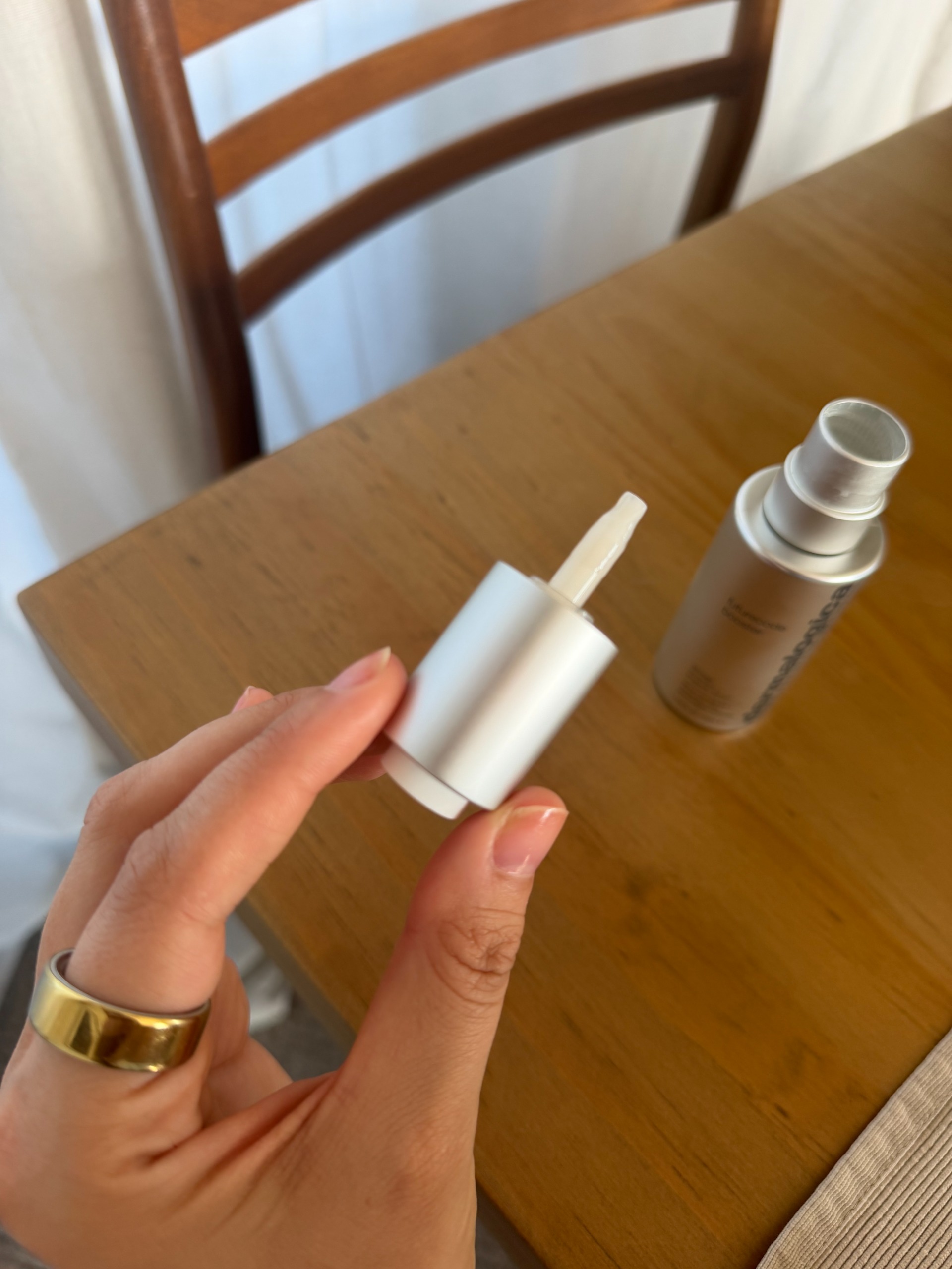 Shannon Lawlor holding the Dermalogica Futurecode Booster pipette in her hand