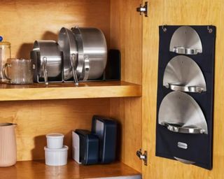 Pots and pans in kitchen cupboard