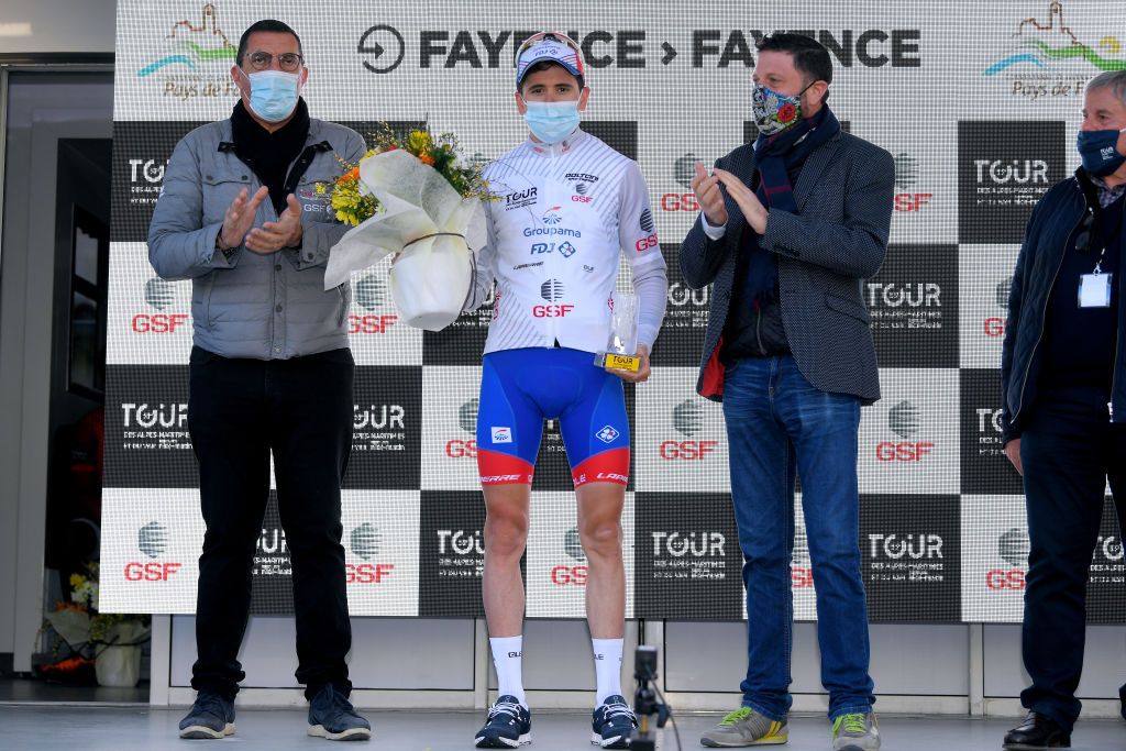 FAYENCE FRANCE FEBRUARY 20 Podium David Gaudu of France and Team Groupama FDJ White Best Young Jersey celebrate during the 53rd Tour Des Alpes Maritimes Et Du Var Stage 2 a 1689km stage from Fayence to Fayence 357m Mask Trophy Flowers Covid safety measures Hostess letour0683 on February 20 2021 in Fayence France Photo by Luc ClaessenGetty Images