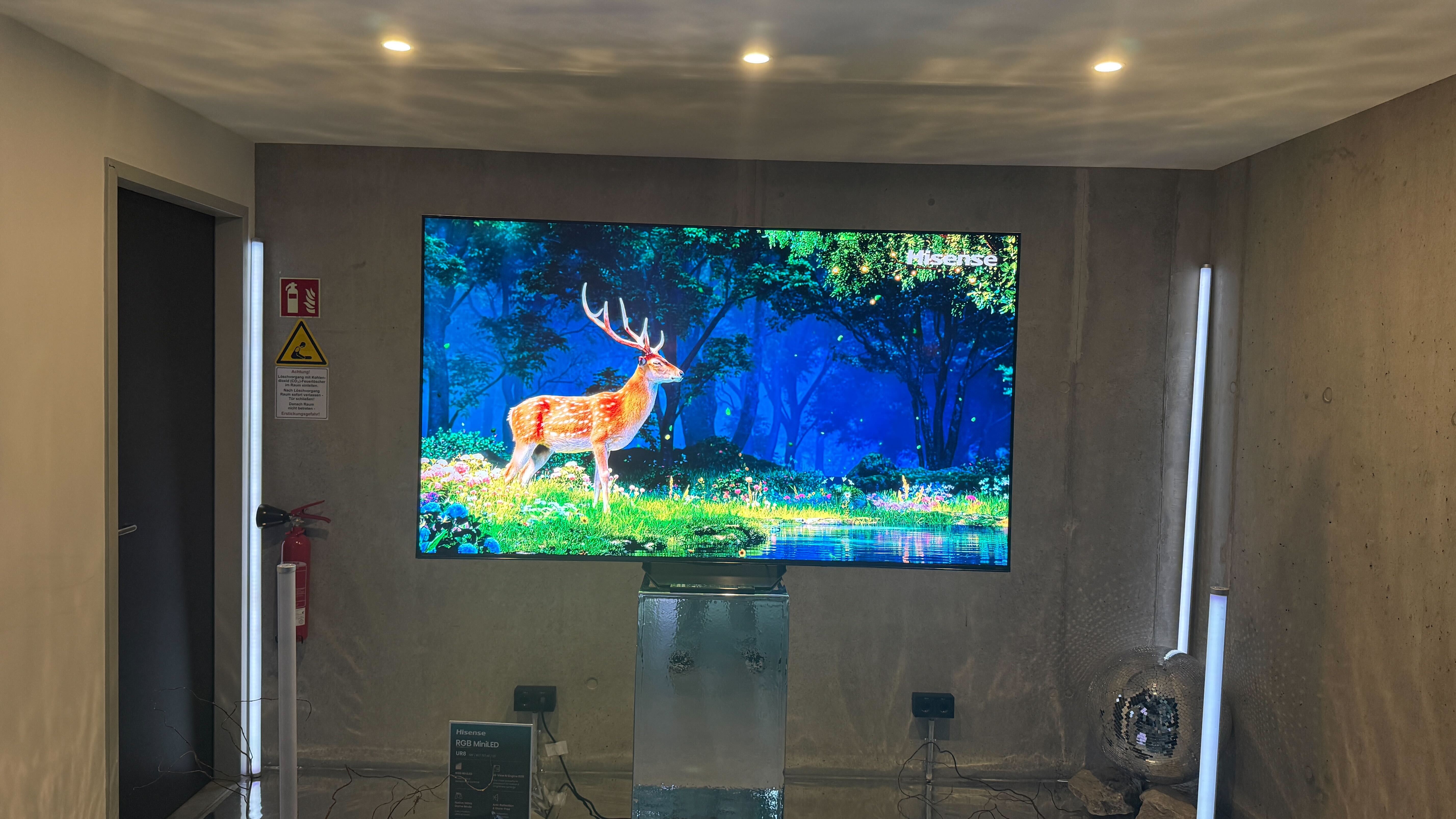 Hisense UR8 on a stand at a press event