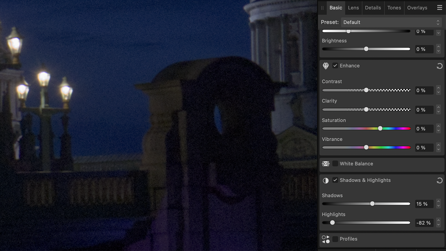 Image of a photo editing interface showing adjustment sliders for brightness, contrast, and color settings against a dark background