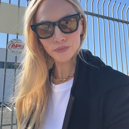 Brooke Ely Danielson wearing light lens sunglasses