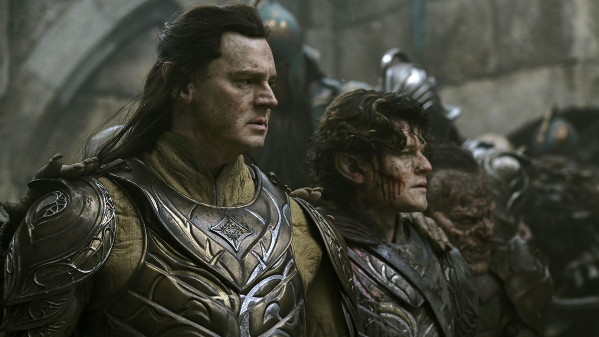 Gil-galad and Elrond look on as Celebrimbor&#039;s texts are burned by orcs in The Rings of Power season 2 episode 8