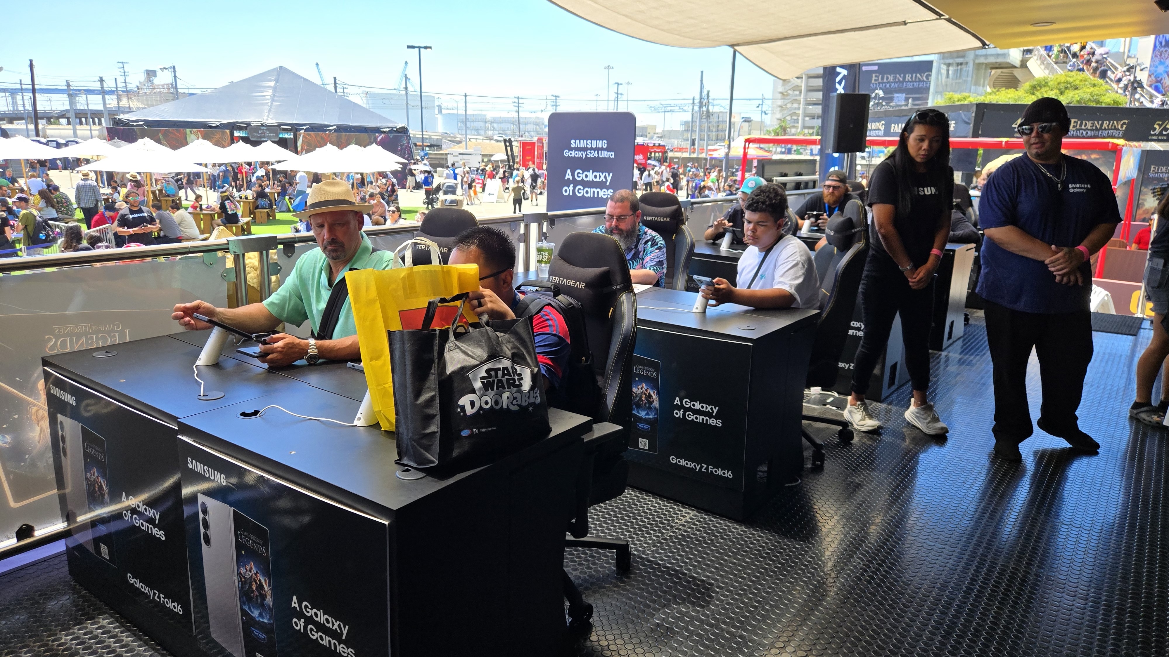 People playing games at Samsung's Comic-Con booth