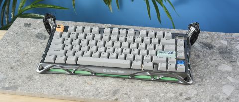 A gray GravaStar Mercury K1 Pro mechanical keyboard, with spider legs