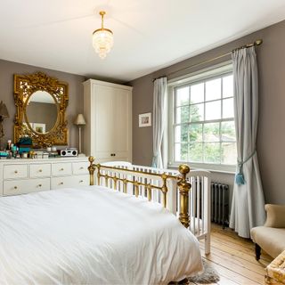 bedroom with chandelier and mirror