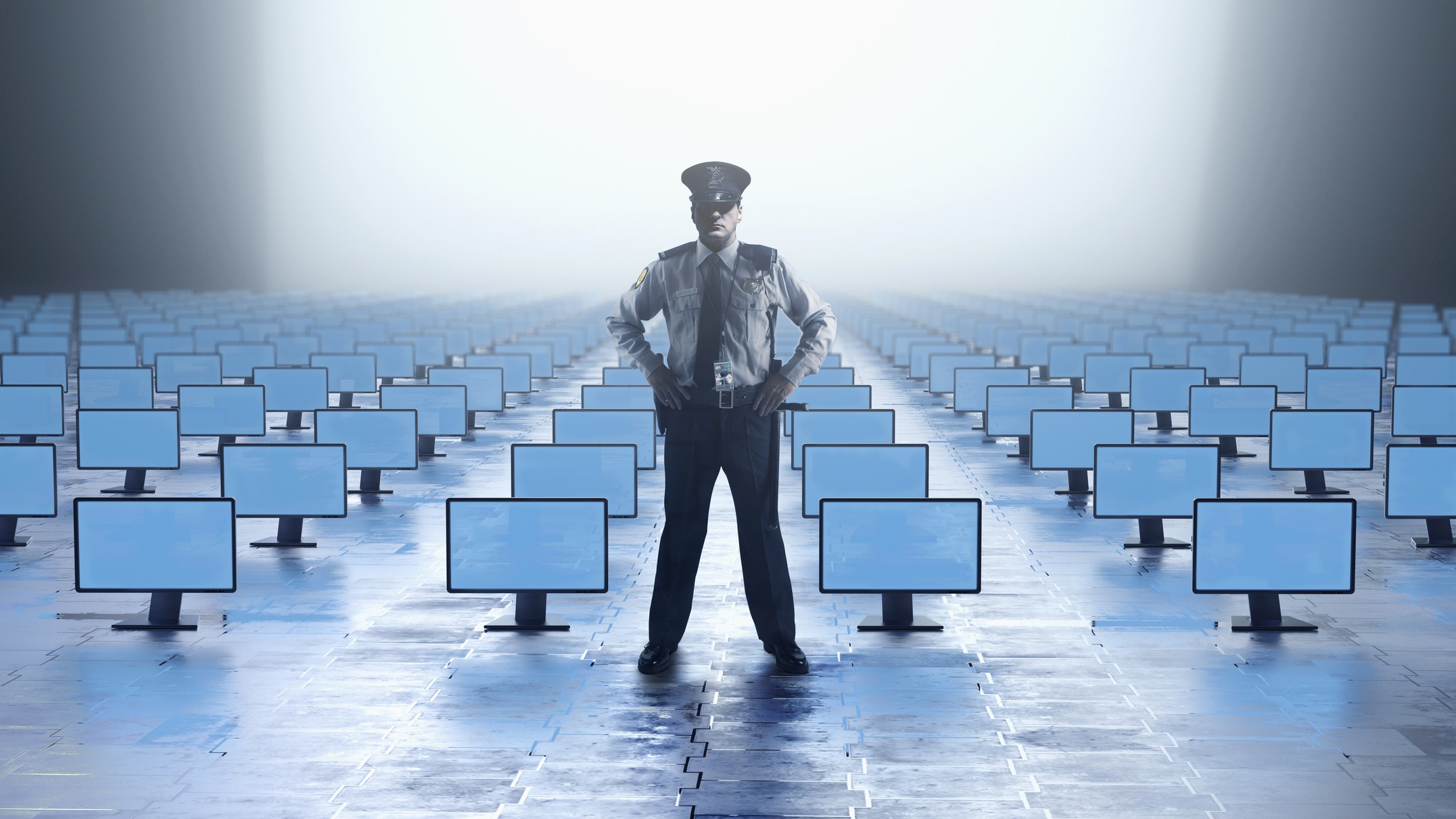 Caucasian security guard watching with abundance of computer monitors - stock photo