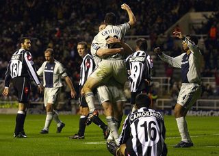 Newcastle celebrate the winning goal scored by Andy Griffin who is lifted up by Andy O' Brien as Nolberto Solano (r) joins in during the UEFA Champions League, Group E match between Newcastle United and Juventus at St. James' Park in Newcastle on October 23, 2002.