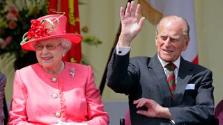 Queen Elizabeth II and Prince Philip, Duke of Edinburgh watch the Shropshire Diamond Jubilee Pageant