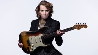 Serbian blues rock guitarist and singer Ana Popovic, poses during a photo session in Paris, on March 13, 2023. She is holding her 1964 Fender Stratocaster, which she calls her favorite guitar