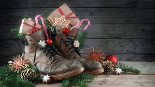 Hiking boots filled with Christmas candy and decorations