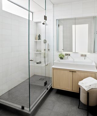 White shower room with floating vanity in light wood