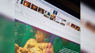 A screenshot showing a picture of a woman giving birth in water being added to a page layout in Blurb