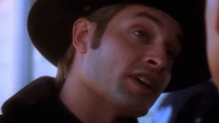 Josh Holloway in close up with a cowboy hat on