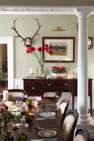 Christmas dining table with flowers candles and festive atmosphere