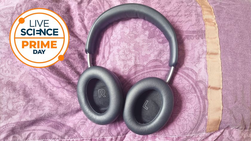 A Live Science Prime Day deal logo and our reviewer&#039;s Bose QuietComfort headphones on a purple background