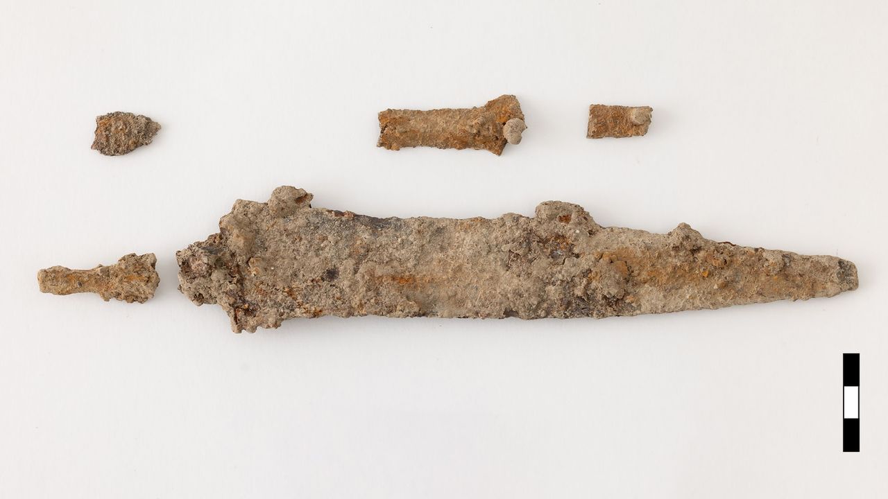 weathered weapons found in a grave