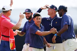 The American team shake hands after victory