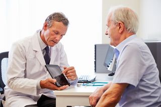 A GP with an elderly patient 