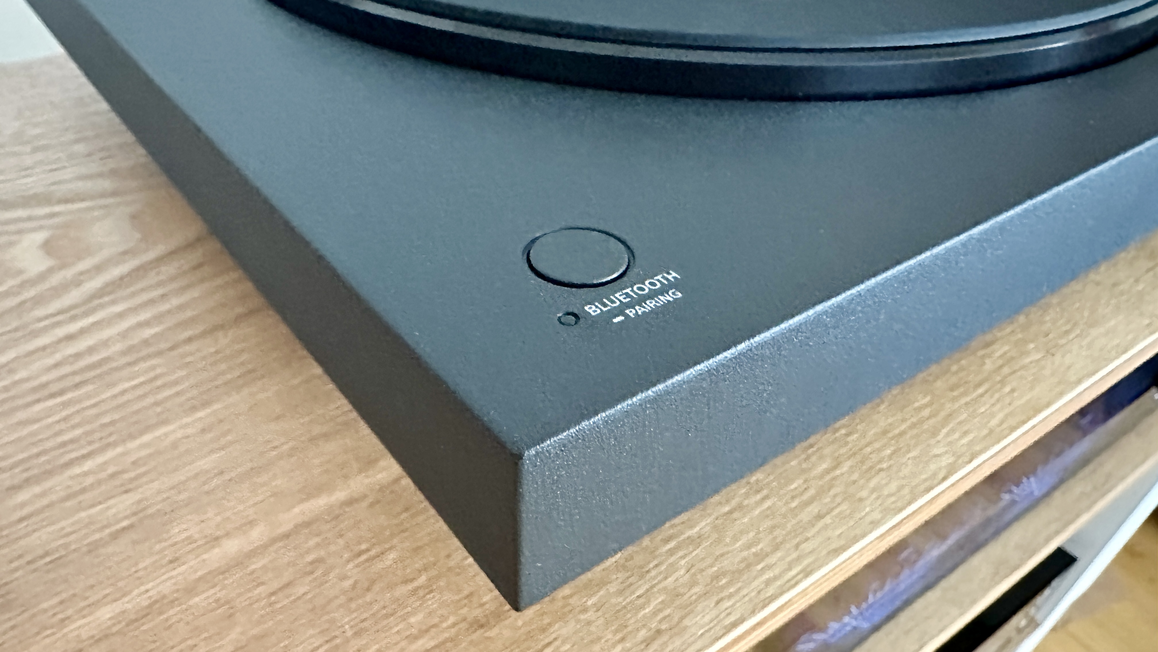 Sony PS-LX510BT turntable on a brown wood hi-fi rack, with closeups