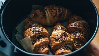 Homemade chocolate croissants with chocolate sprinkles baked in air fryer at home