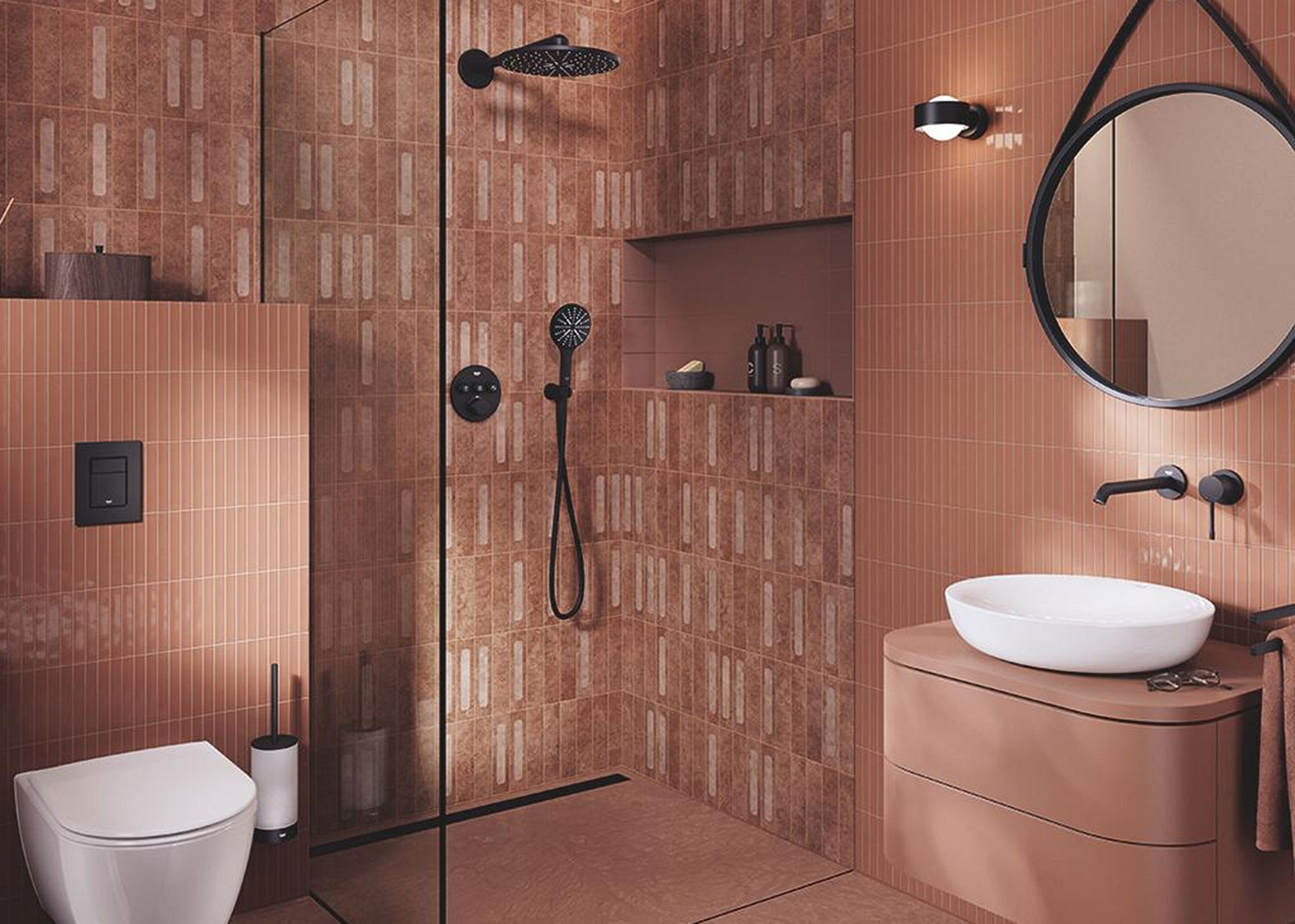 terracotta bathroom with black shower and built-in toilet