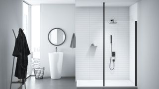 white tiled bathroom with black shower, white modern pedestal sink and grey floor