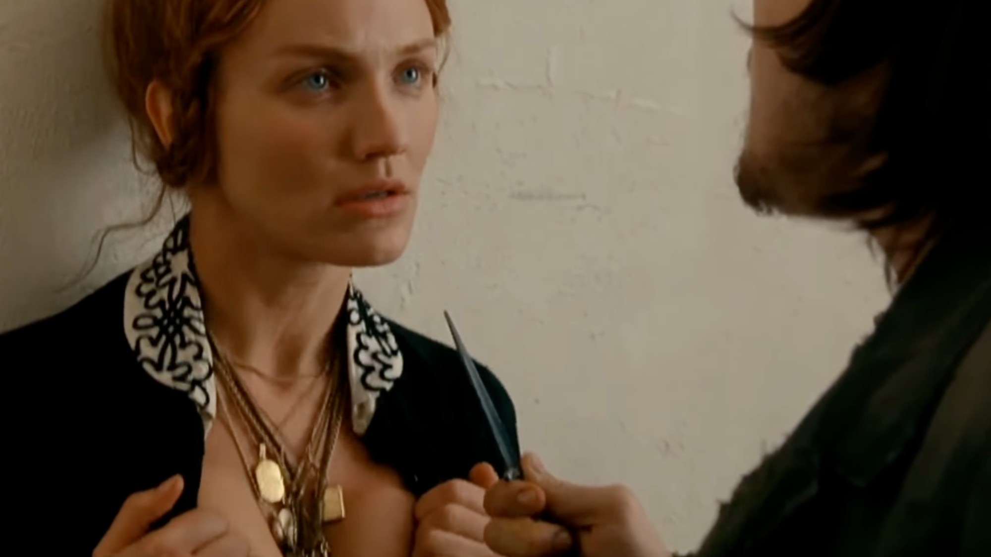 Cameron Diaz looking intensely at Leonardo DiCaprio in The Gangs of New York