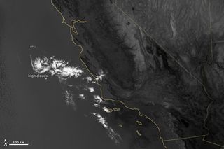 This image shows a layer of high clouds seen at night in the thermal infrared specturm of light. A lower level of marine layer clouds sitting below is invsible in this band of light because their temperature is too close to the ground to distinguish them.