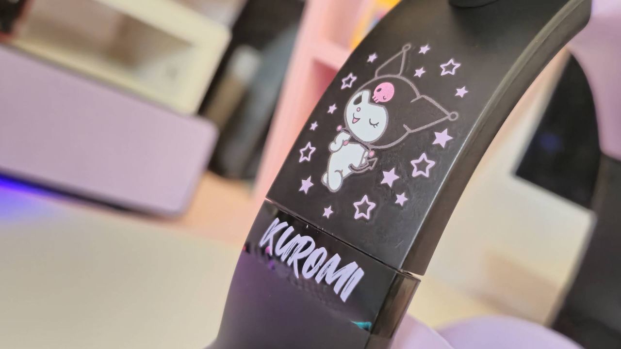 Photos taken by writer Rosalie Newcombe of the Razer Kraken Kitty V2 BT Kuromi Edition gaming headset, on a white desk.