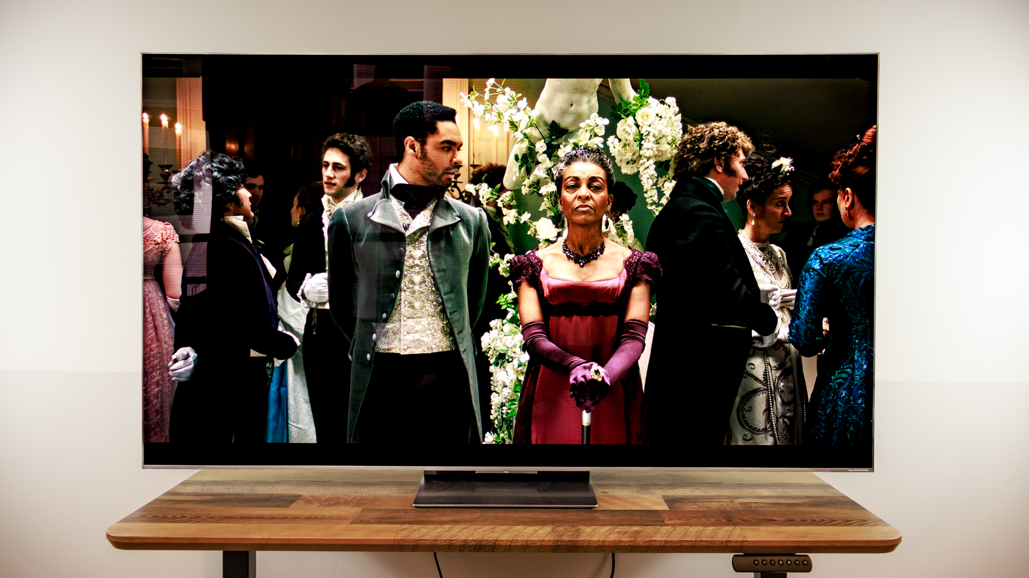 A TCL QM8L TV on a desk