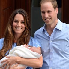 Kate Middleton and Prince William holding newborn Prince George at the hospital