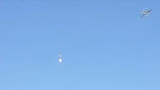 SpaceX's Falcon 9 rocket first stage booster is seen while approaching Landing Zone 4 at Vandenberg Air Force Base in California after launching NASA/ESA's Sentinel-6 Michael Freilich satellite on Nov. 21, 2020.
