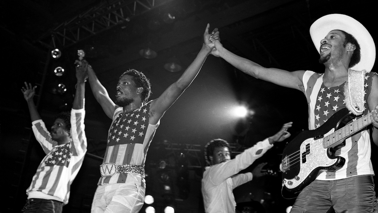 Singers and musicians Ronnie, Charlie and Robert Wilson of The Gap Band prepares to take a bow after their performance at the U.I.C. Pavilion in Chicago, Illinois in January 1983.