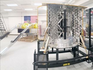 Astrobotic's Griffin analog model (at left) and Peregrine structural test model in the company's clean room.