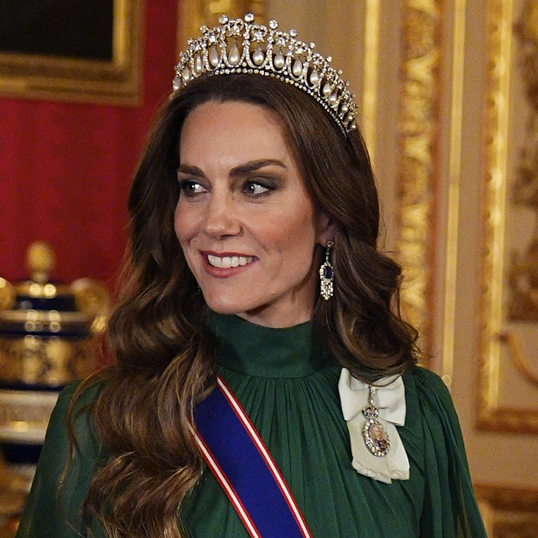 Princess Kate wearing a green dress and tiara