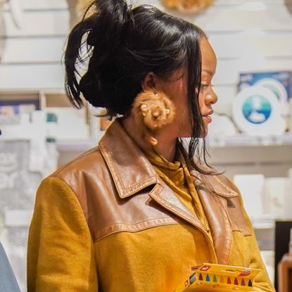 Rihanna was spotted in Paris wearing baggy straight-leg jeans with heeled sandals