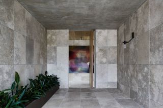 Stone entry room at monumental house in Melbourne