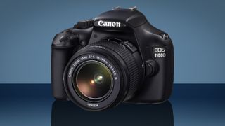 Canon EOS 1100D against a blue background