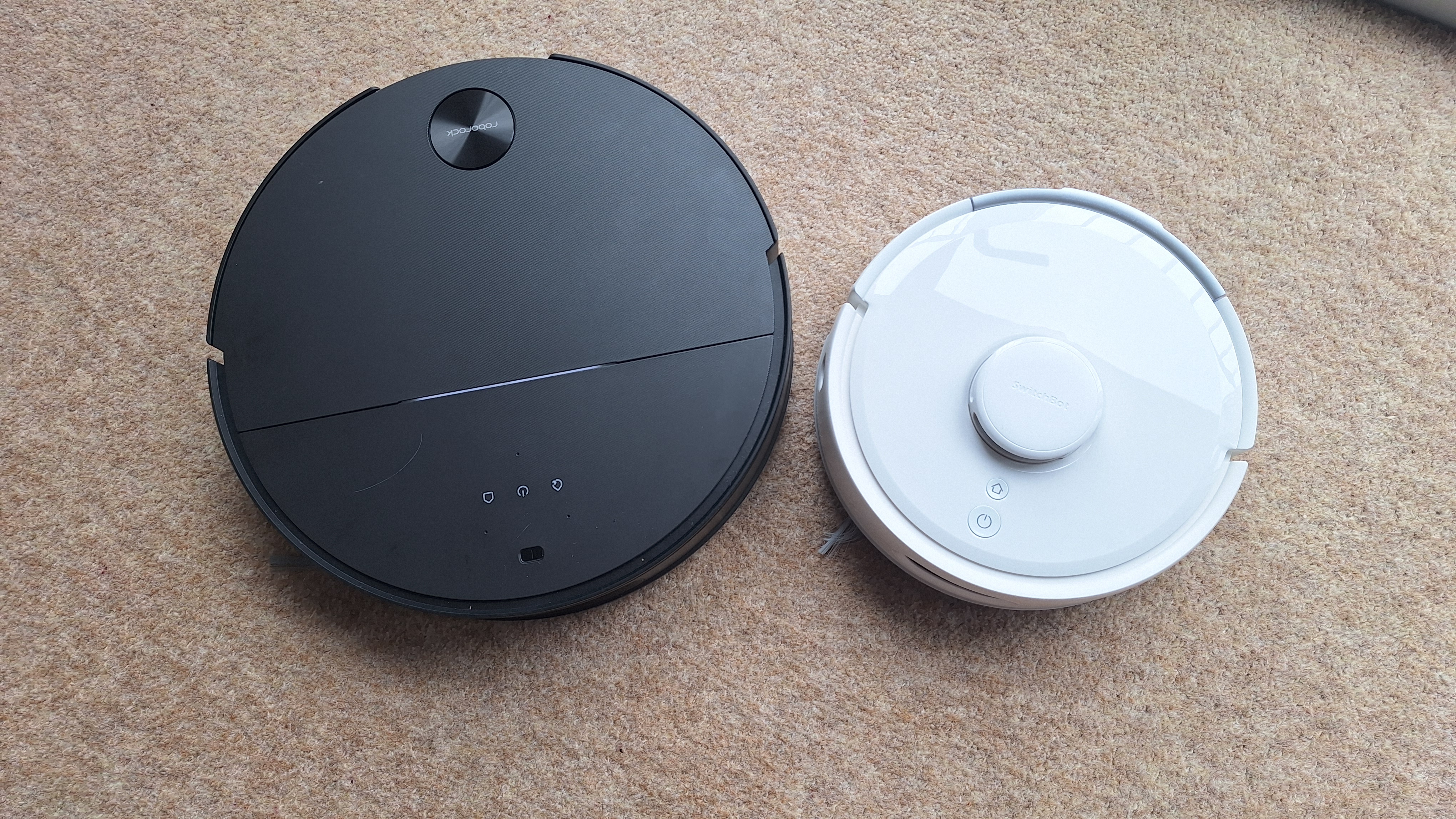 SwitchBot K11+ next to Roborock Saros 10