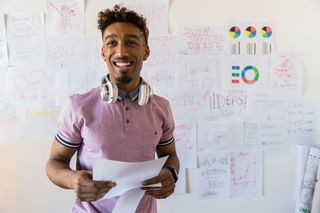 Man standing in front of a white board