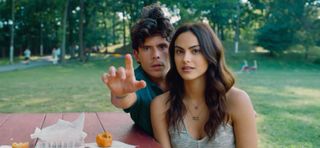 rudy mancuso and camila mendes, sitting at a picnic table in the park, in the rom-com 'musica'